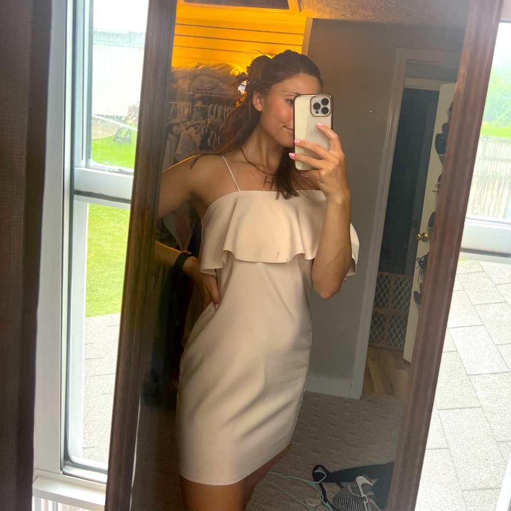 Nude One strap with one side off the shoulder with ruffle
